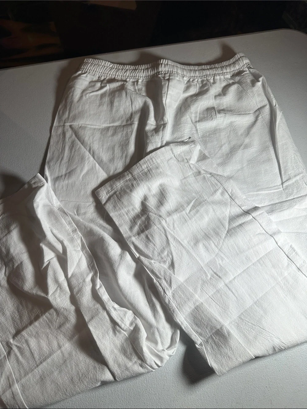 2 pack of Women's lightweight pants. One white and one black pair of medium pant